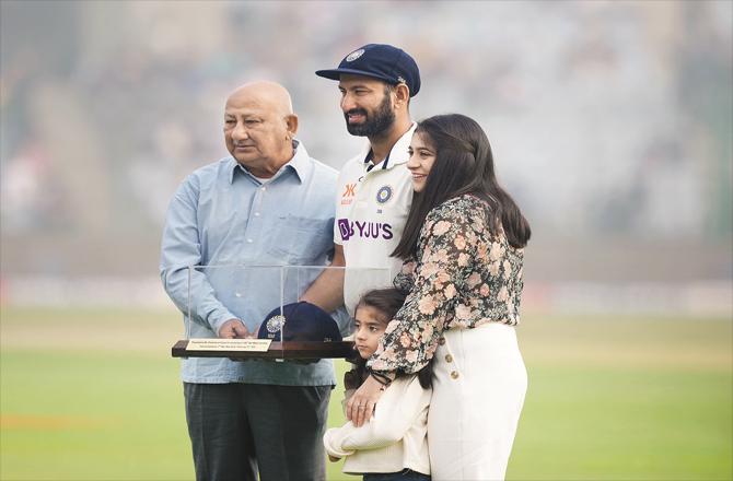 Cheteshwar Pujara , on the field with family